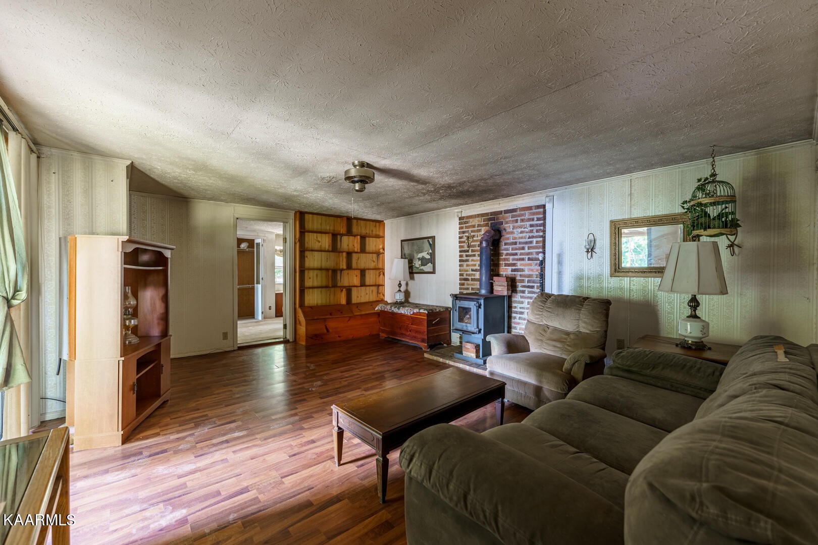 203 Duggan Road Lenoir City, TN 37771 - Photo 12 of 16 a living room with furniture and a wooden floor