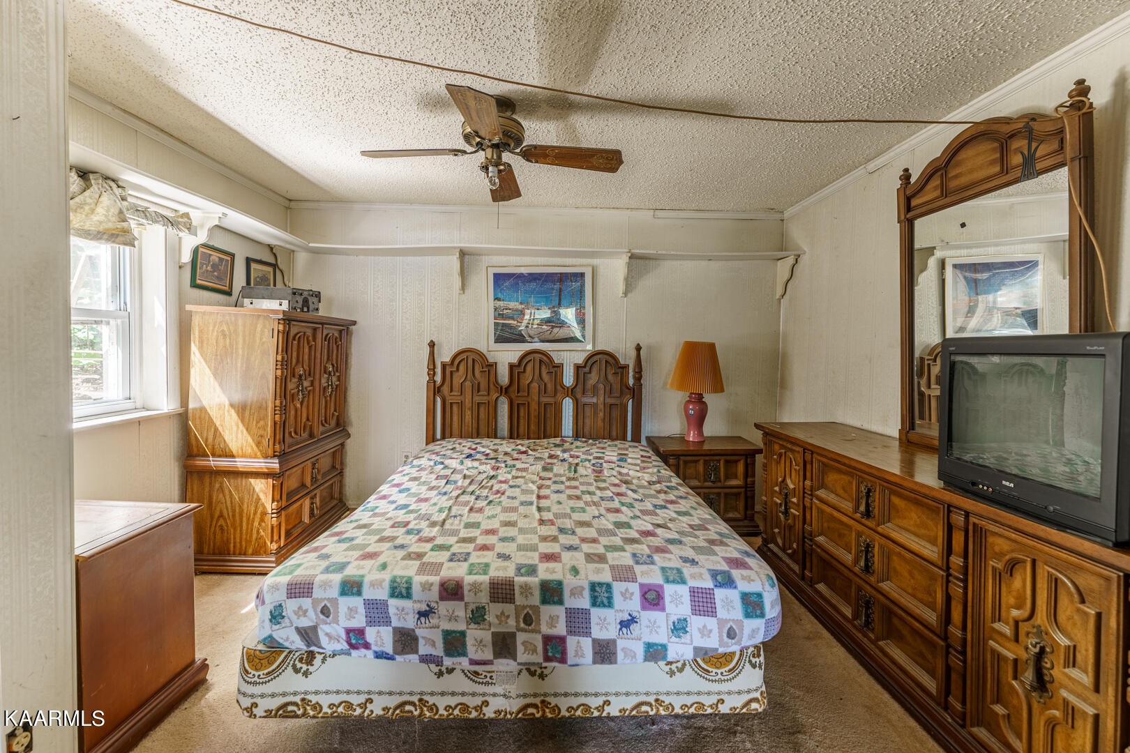 203 Duggan Road Lenoir City, TN 37771 - Photo 13 of 16 a bedroom with a bed and wooden furniture
