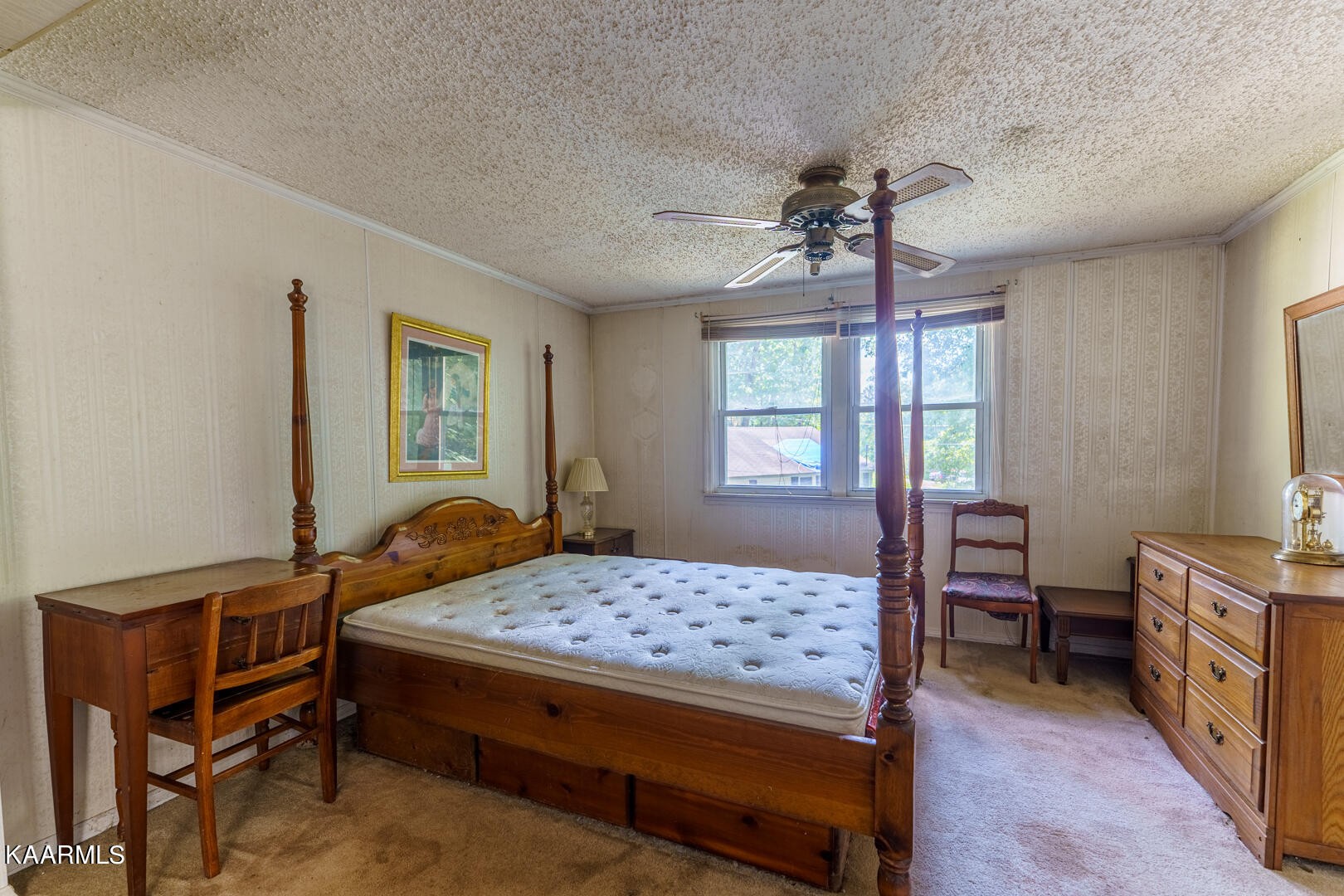 203 Duggan Road Lenoir City, TN 37771 - Photo 14 of 16 a bedroom with a bed and a chandelier