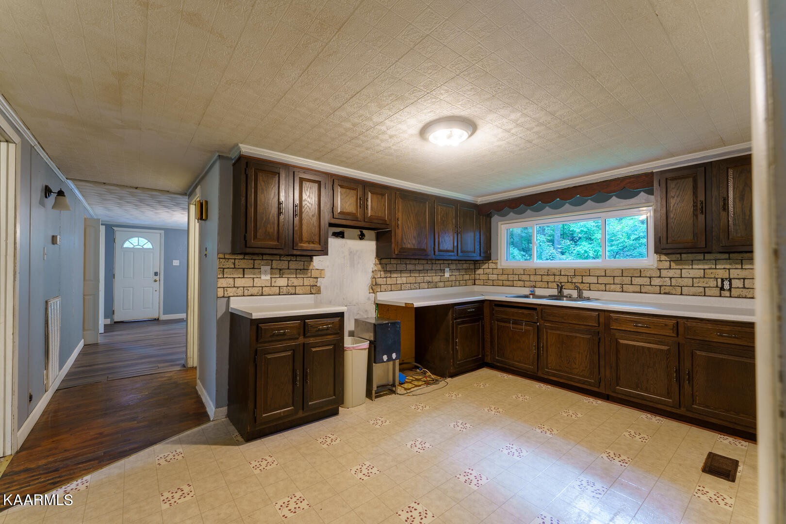 203 Duggan Road Lenoir City, TN 37771 - Photo 7 of 16 a kitchen with stainless steel appliances granite countertop a stove sink and cabinets