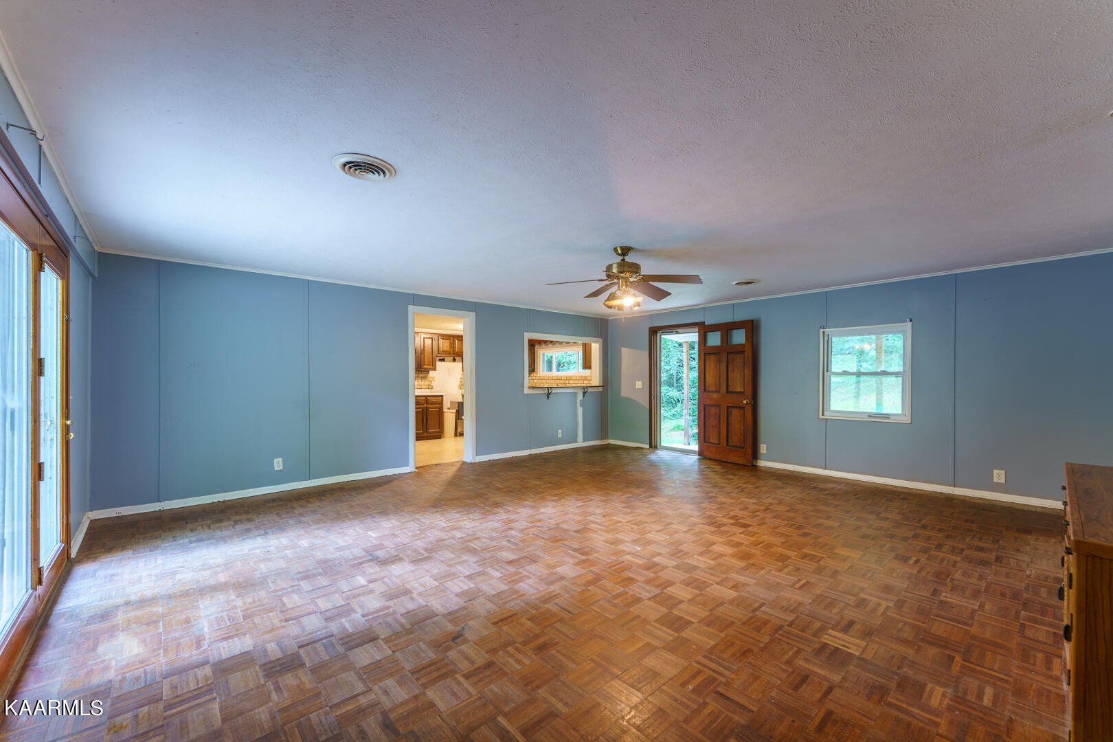203 Duggan Road Lenoir City, TN 37771 - Photo 8 of 16 a view of a big room with windows and chandelier fan
