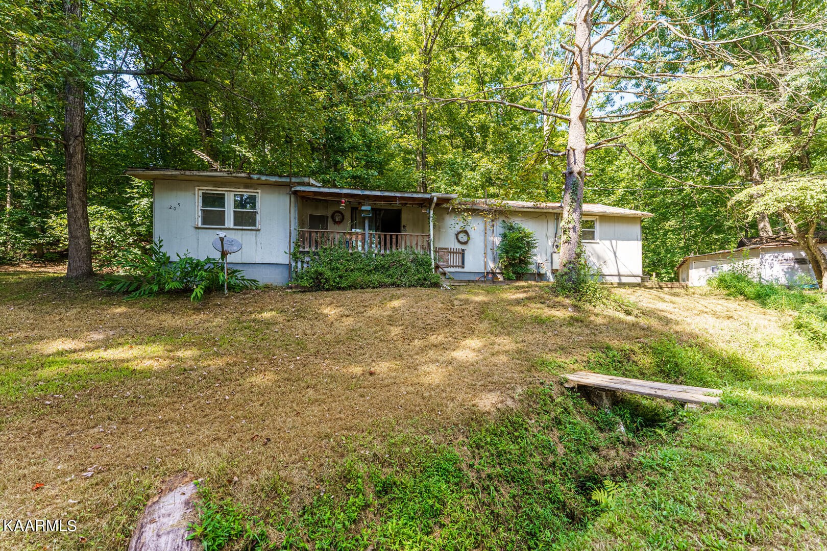 203 Duggan Road Lenoir City, TN 37771 - Photo 9 of 16 a backyard of a house with barbeque oven table and chairs