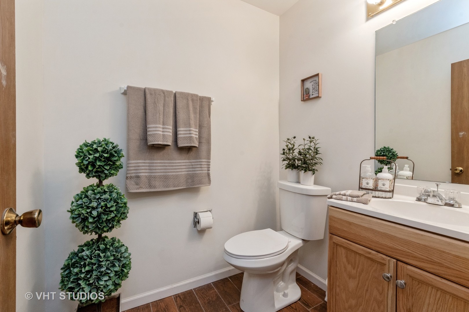 57 Timberlane Road Matteson, IL 60443 - Photo 16 of 25 a bathroom with a sink toilet and mirror