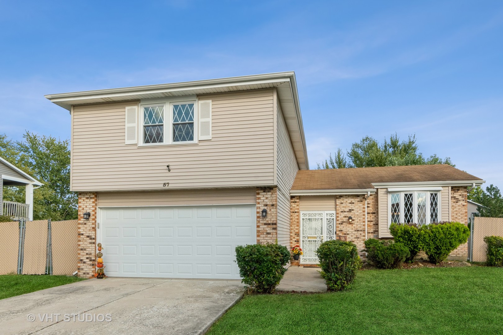 57 Timberlane Road Matteson, IL 60443 - Photo 25 of 25 a front view of a house with a yard and garage