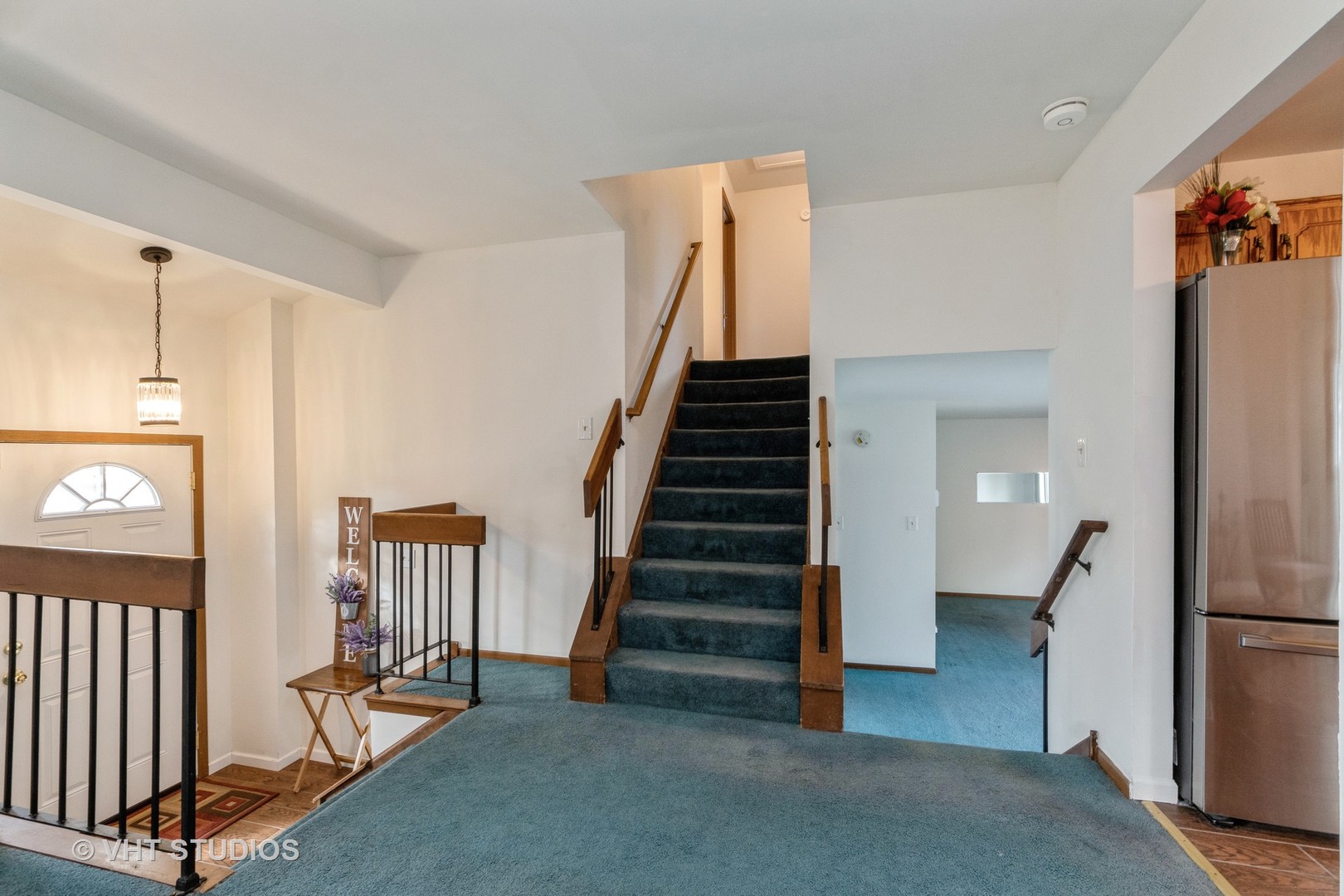 57 Timberlane Road Matteson, IL 60443 - Photo 3 of 25 a view of a hallway with entryway wooden floor and staircase