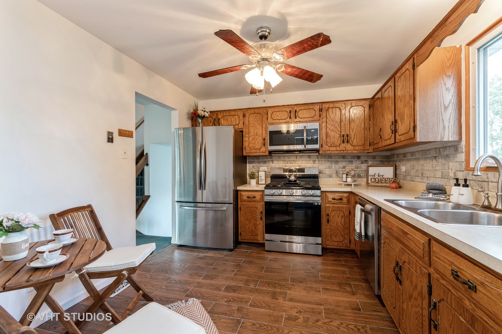 57 Timberlane Road Matteson, IL 60443 - Photo 7 of 25 a kitchen with cabinets a sink and stainless steel appliances