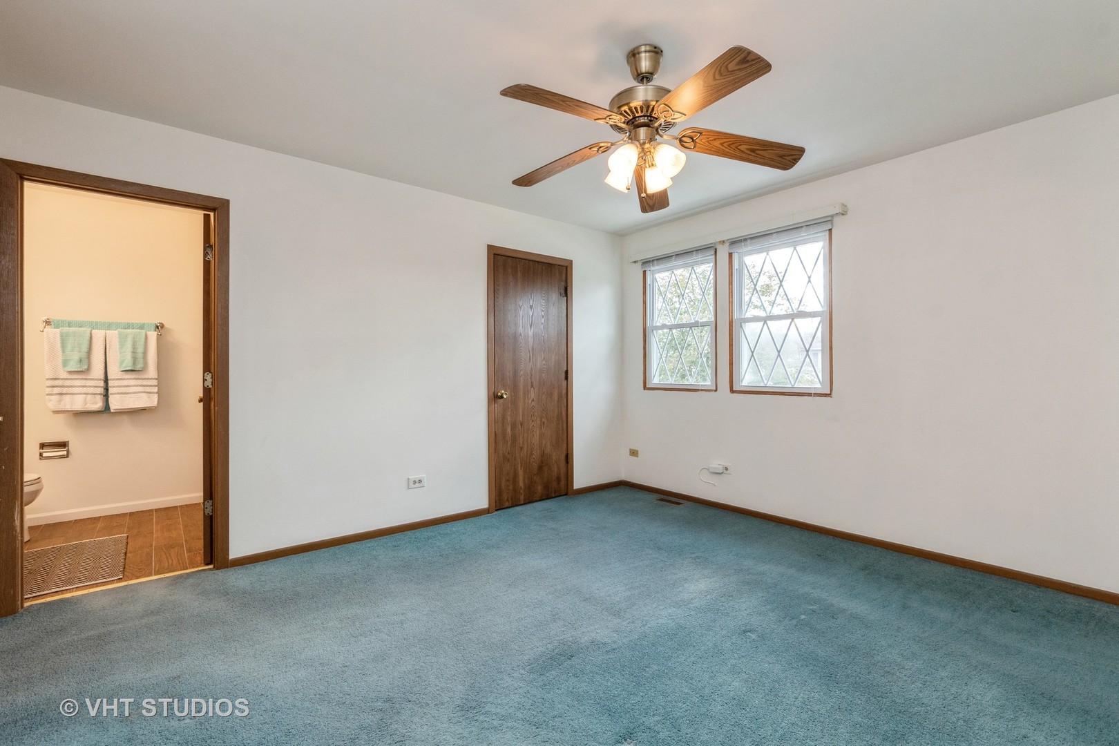 57 Timberlane Road Matteson, IL 60443 - Photo 10 of 25 an empty room with windows and fan