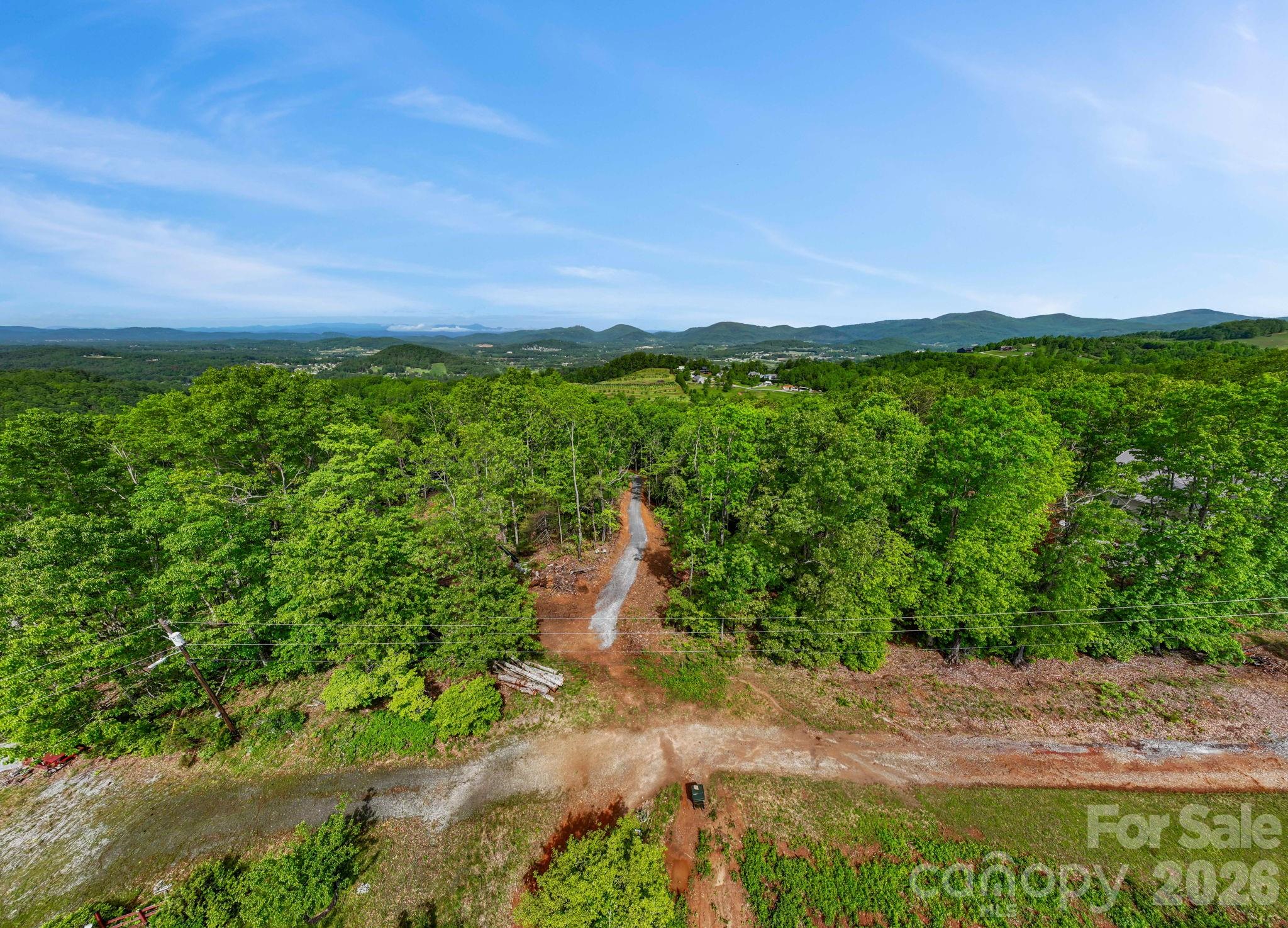 0 John Delk Road, Unit 3 Hendersonville, NC 28792 - Photo 15 of 25 a view of a yard with a lake view