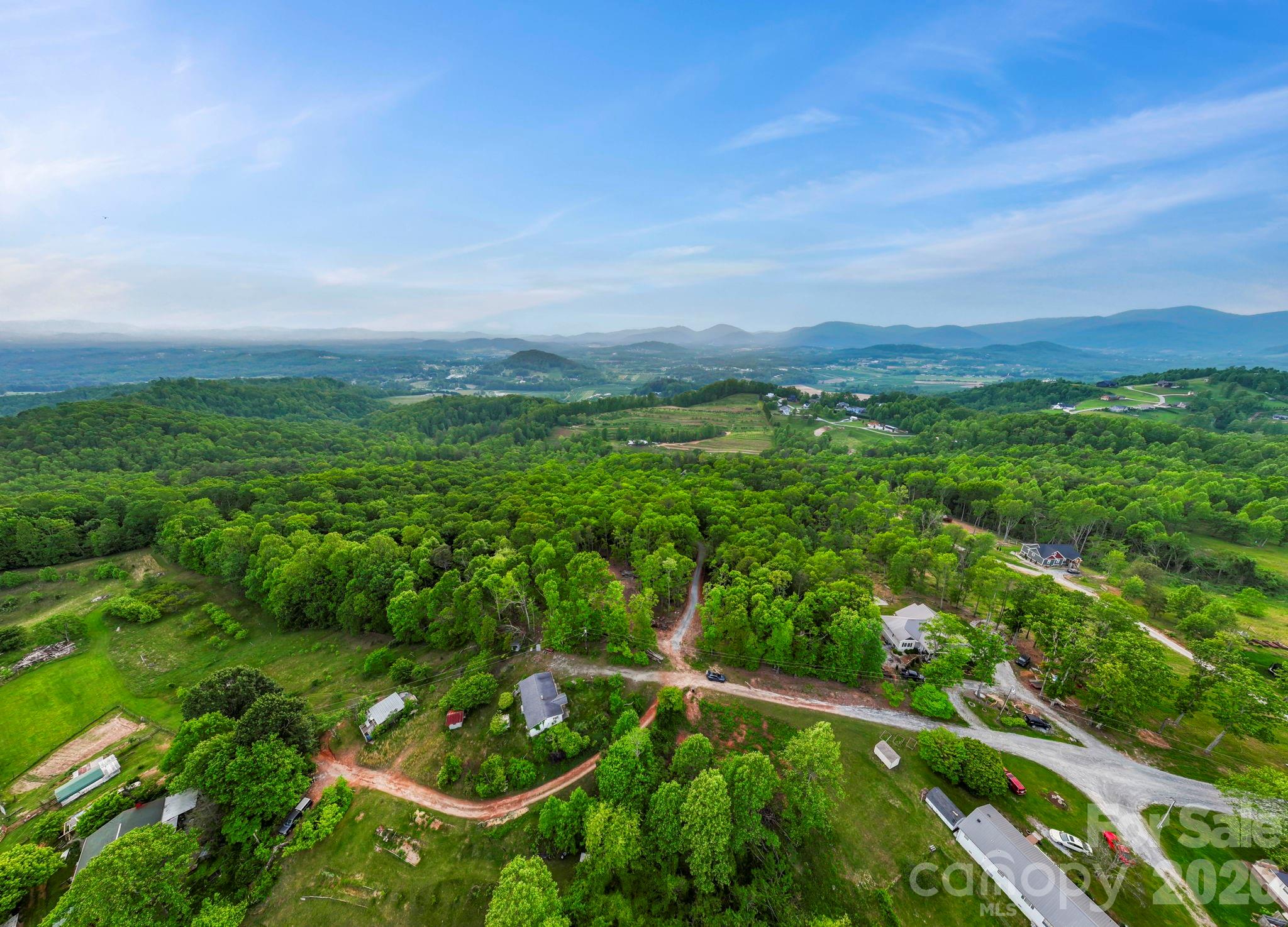 0 John Delk Road, Unit 3 Hendersonville, NC 28792 - Photo 23 of 25 a view of a city with lush green forest