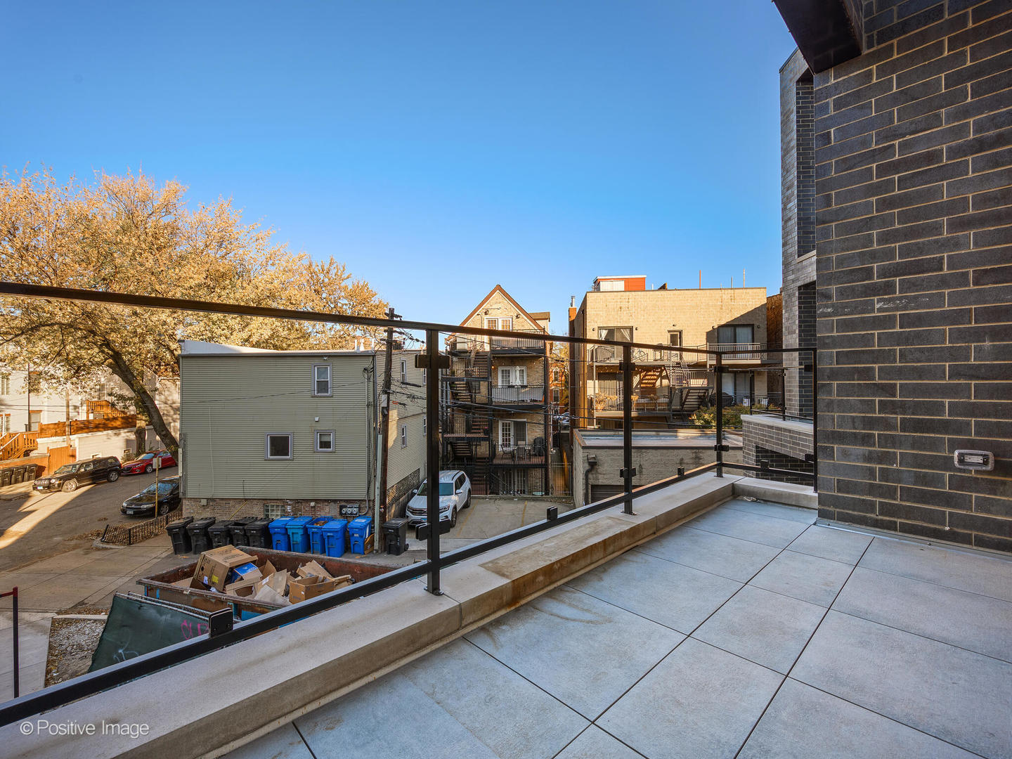 1412 North Elk Grove Avenue, Unit E Chicago, IL 60622 - Photo 22 of 24 a view of a terrace with a bench