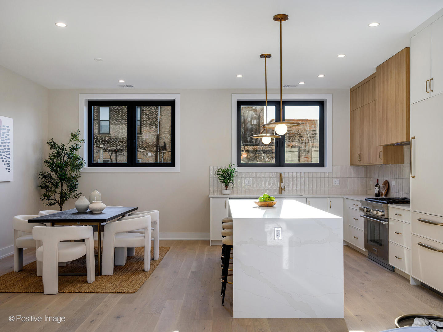 1412 North Elk Grove Avenue, Unit E Chicago, IL 60622 - Photo 7 of 24 a kitchen with a sink stove and cabinets