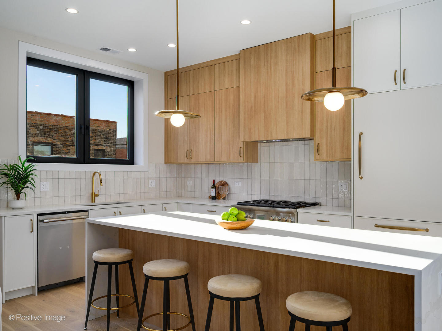 1412 North Elk Grove Avenue, Unit E Chicago, IL 60622 - Photo 8 of 24 a kitchen with a sink cabinets and wooden floor