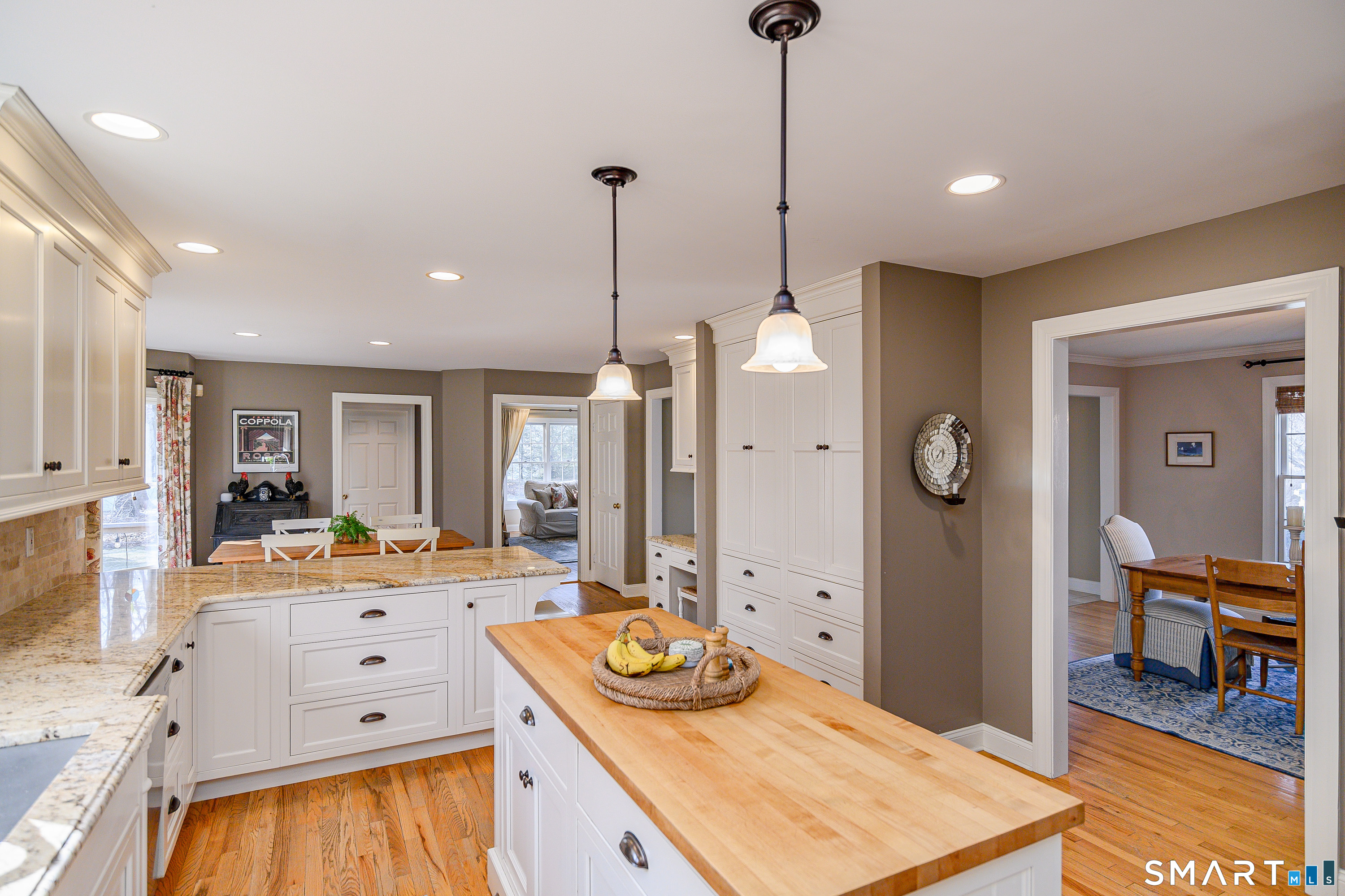20 Charter Ridge Drive Newtown, CT 06482 - Photo 14 of 40 Flow seamlessly from the dining room to the kitchen.