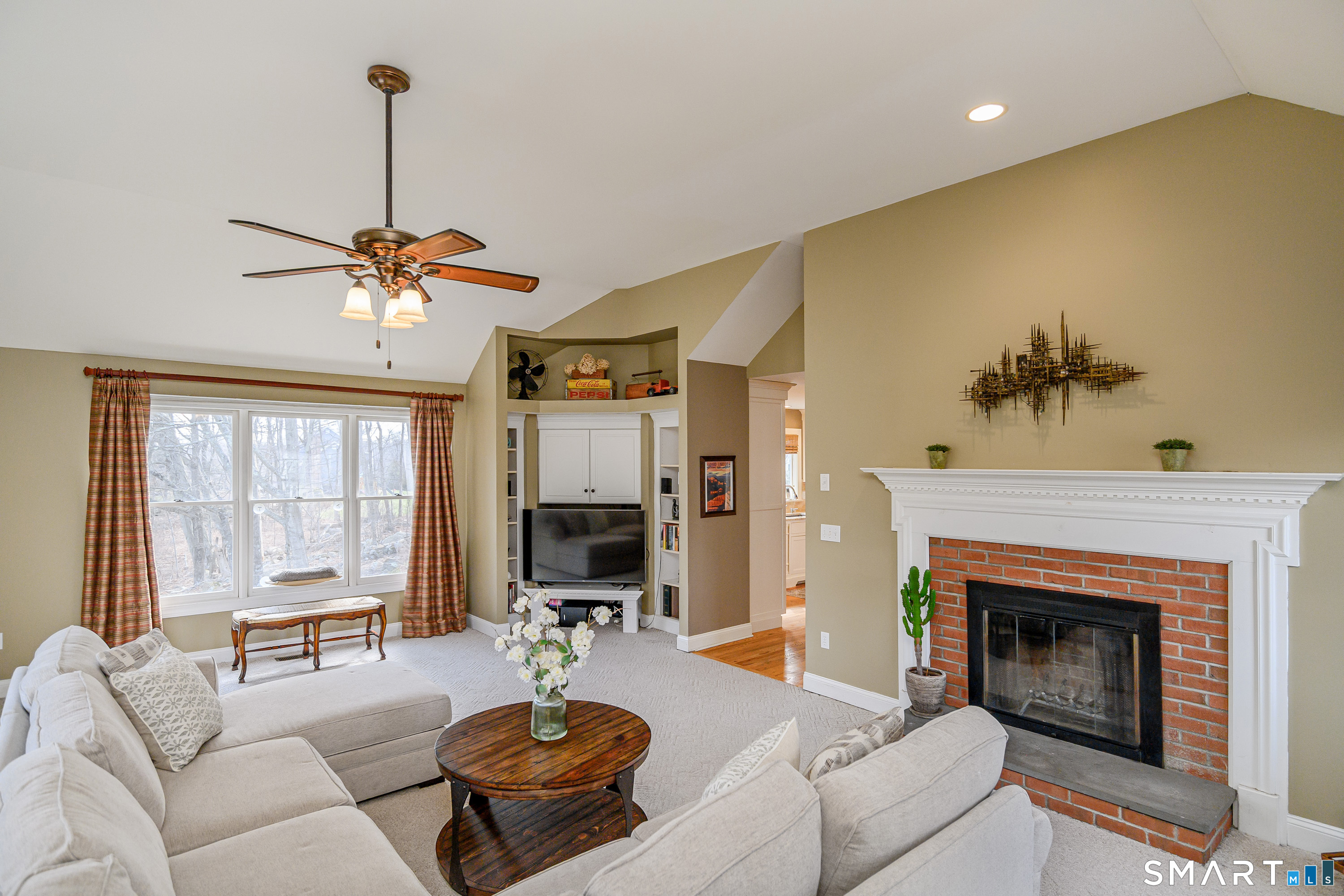 20 Charter Ridge Drive Newtown, CT 06482 - Photo 17 of 40 The great room features a wood-burning fireplace and built-in entertainment center.