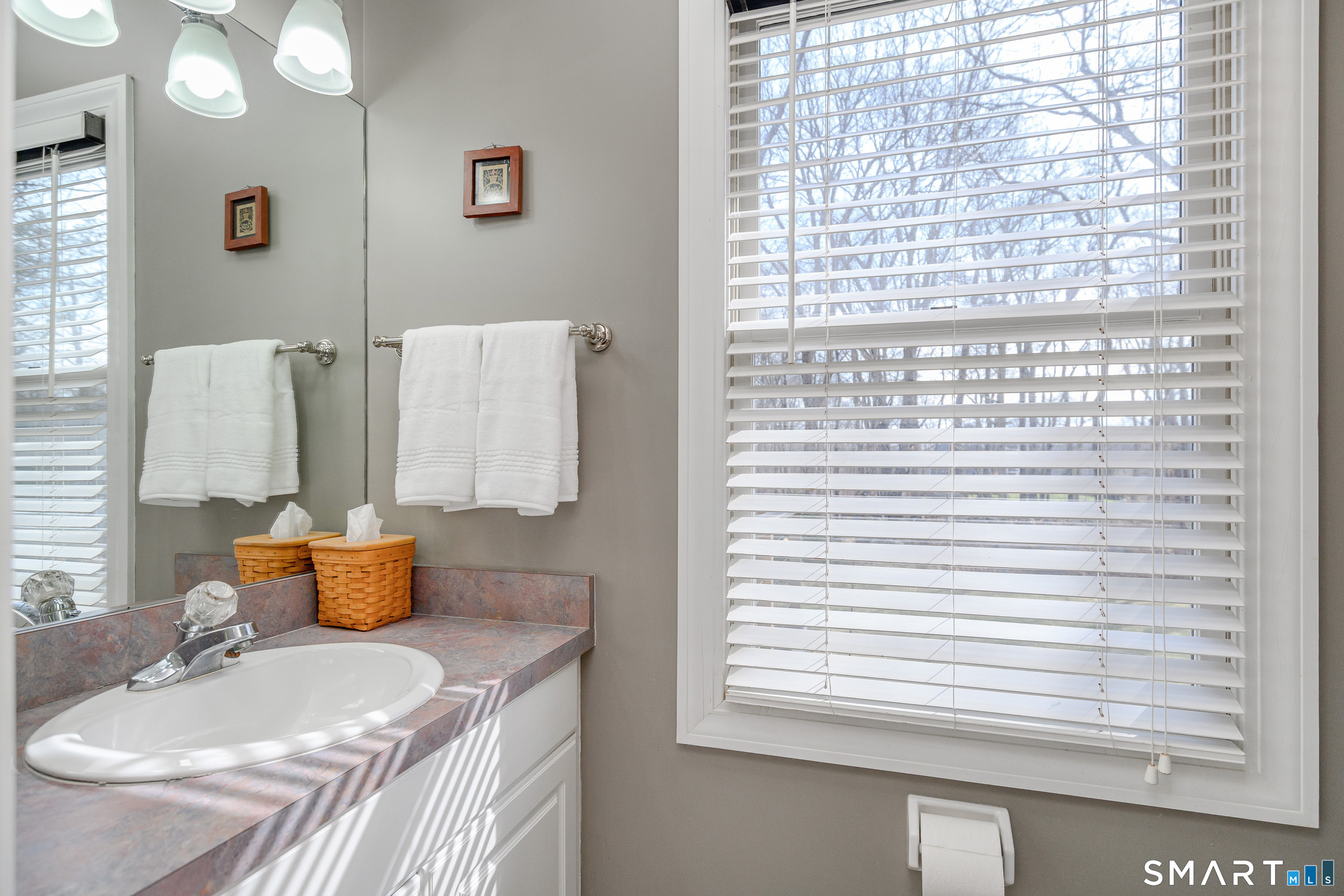 20 Charter Ridge Drive Newtown, CT 06482 - Photo 18 of 40 A half bathroom located off the kitchen on the main level.