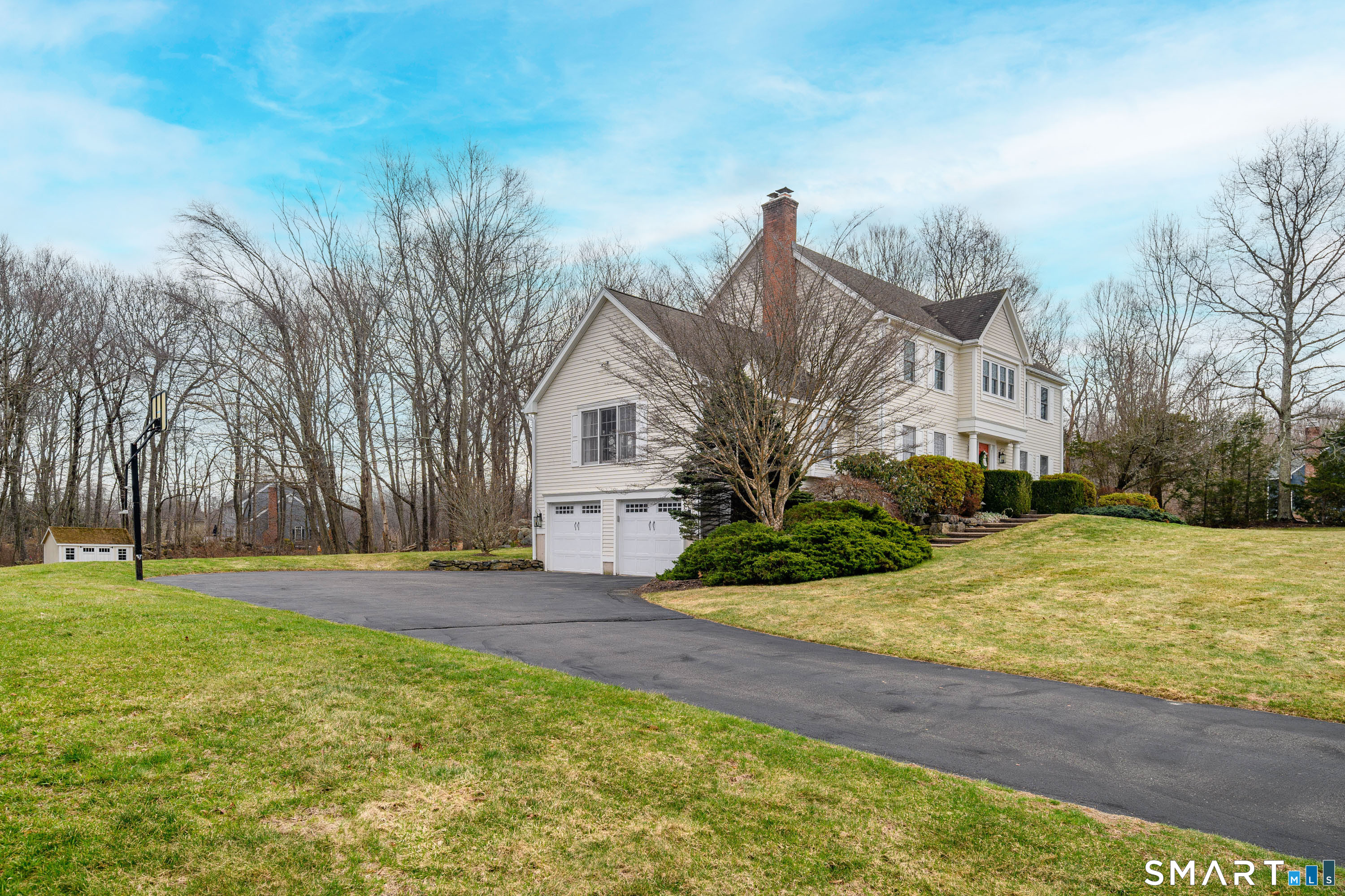 20 Charter Ridge Drive Newtown, CT 06482 - Photo 3 of 40 A wide driveway leading to the 2-car garage with plenty of room for parking.
