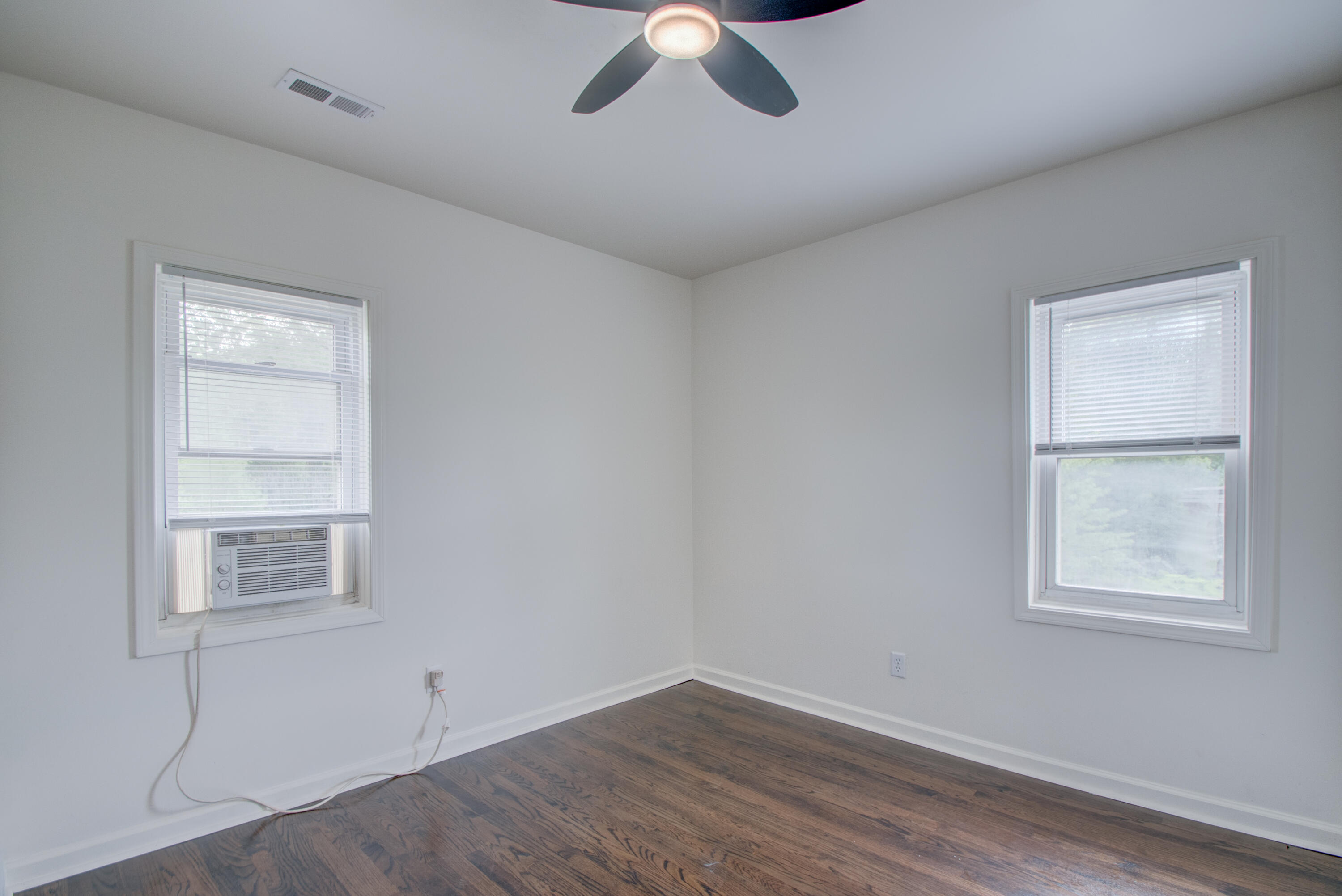 613 Tennessee Street Gary, IN 46402 - Photo 10 of 39 a view of room with window and ceiling fan