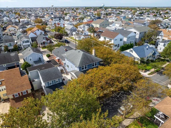 an aerial view of house with yard