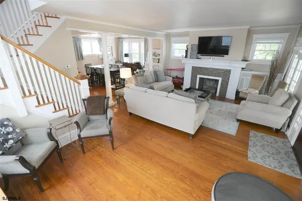 a living room with fireplace furniture and a flat screen tv
