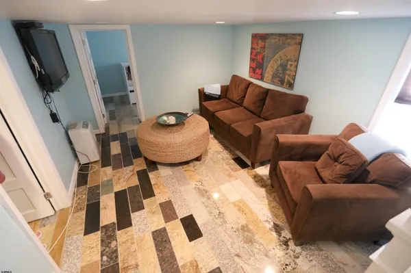 a living room with furniture and a rug