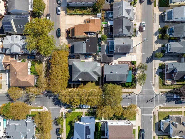 an aerial view of multiple houses with outdoor space