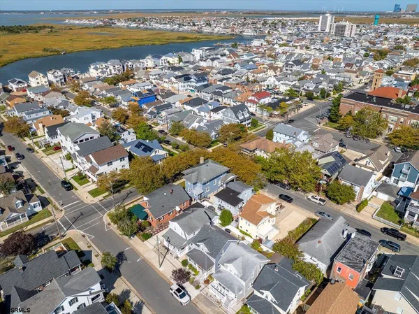 an aerial view of a city with ocean view