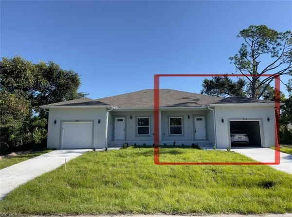a view of a house with swimming pool and a yard