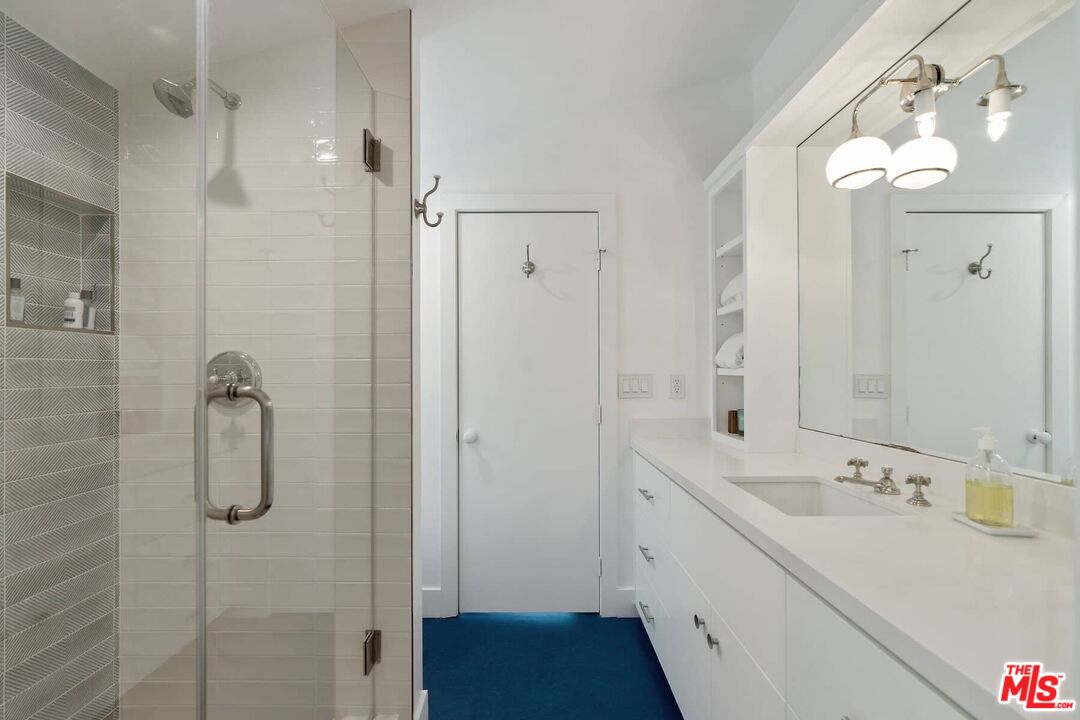 249 Paradise Cove Road Malibu, CA 90265 - Photo 22 of 41 a bathroom with a double vanity sink mirror and shower