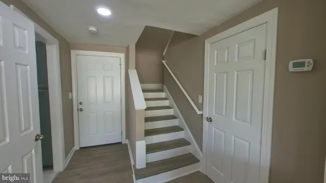 a view of a hallway with stairs