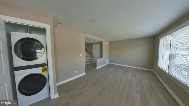 a view of a hallway with washer and dryer