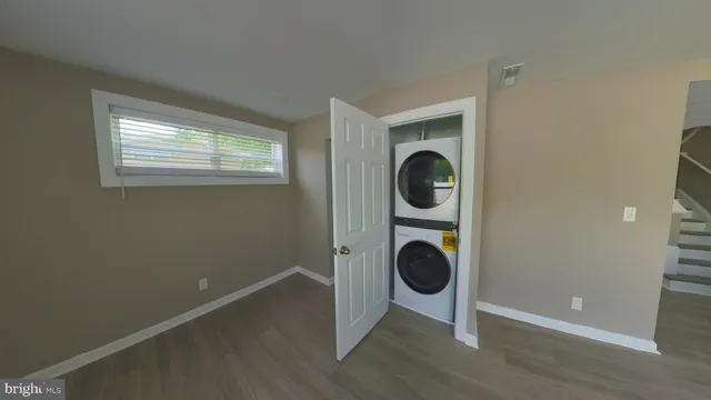 a view of a hallway with washer and dryer