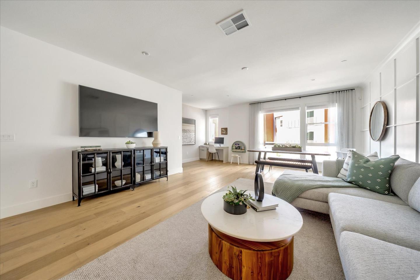 567 Pilgrim Drive Foster City, CA 94404 - Photo 2 of 14 a living room with furniture and a flat screen tv