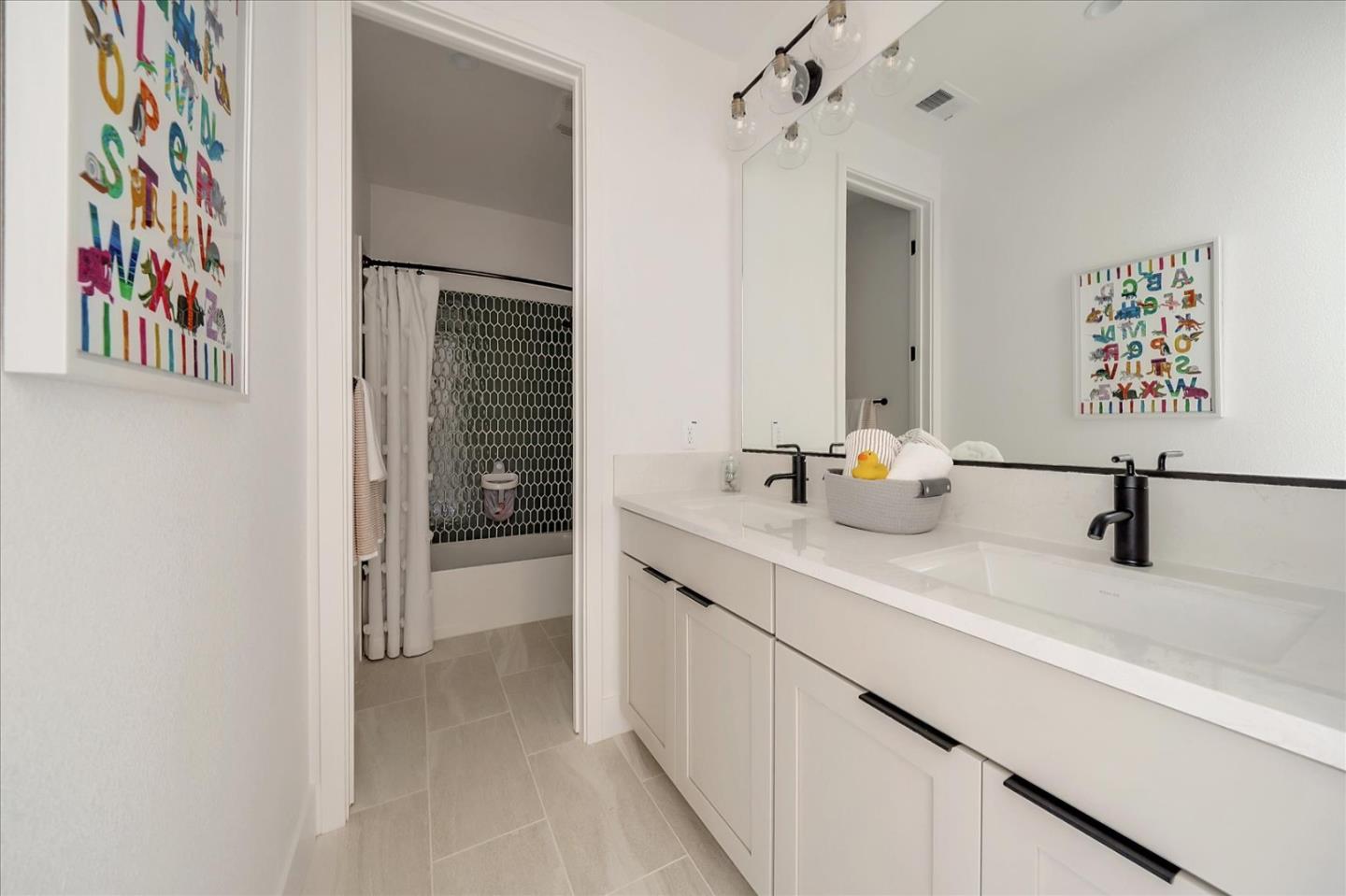 567 Pilgrim Drive Foster City, CA 94404 - Photo 5 of 14 a bathroom with a sink and a mirror