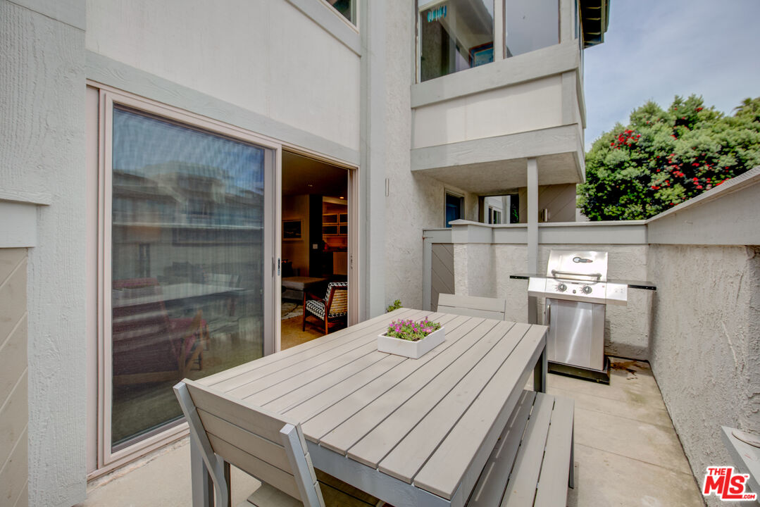 3544 Sunset Lane Oxnard, CA 93035 - Photo 13 of 56 a dining room with a table and chairs