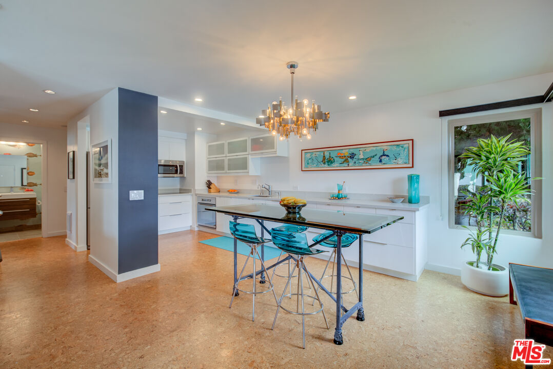 3544 Sunset Lane Oxnard, CA 93035 - Photo 14 of 56 a view of a dining room with furniture a livingroom and chandelier