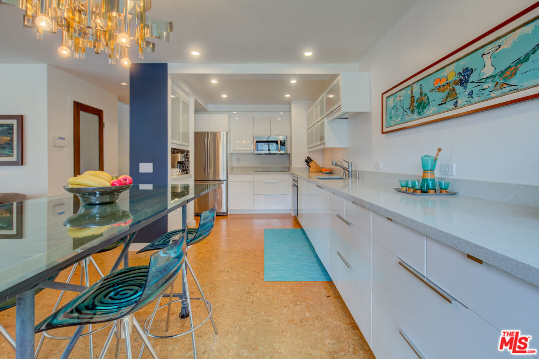 3544 Sunset Lane Oxnard, CA 93035 - Photo 16 of 56 a large white kitchen with lots of counter space