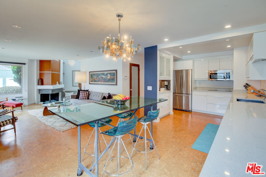 3544 Sunset Lane Oxnard, CA 93035 - Photo 17 of 56 a dining hall with stainless steel appliances kitchen island granite countertop furniture and a kitchen view