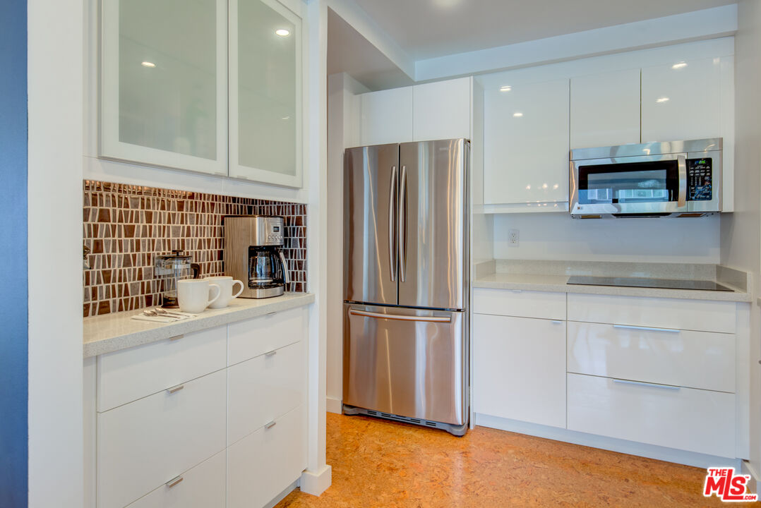 3544 Sunset Lane Oxnard, CA 93035 - Photo 19 of 56 a kitchen with stainless steel appliances a refrigerator sink and microwave