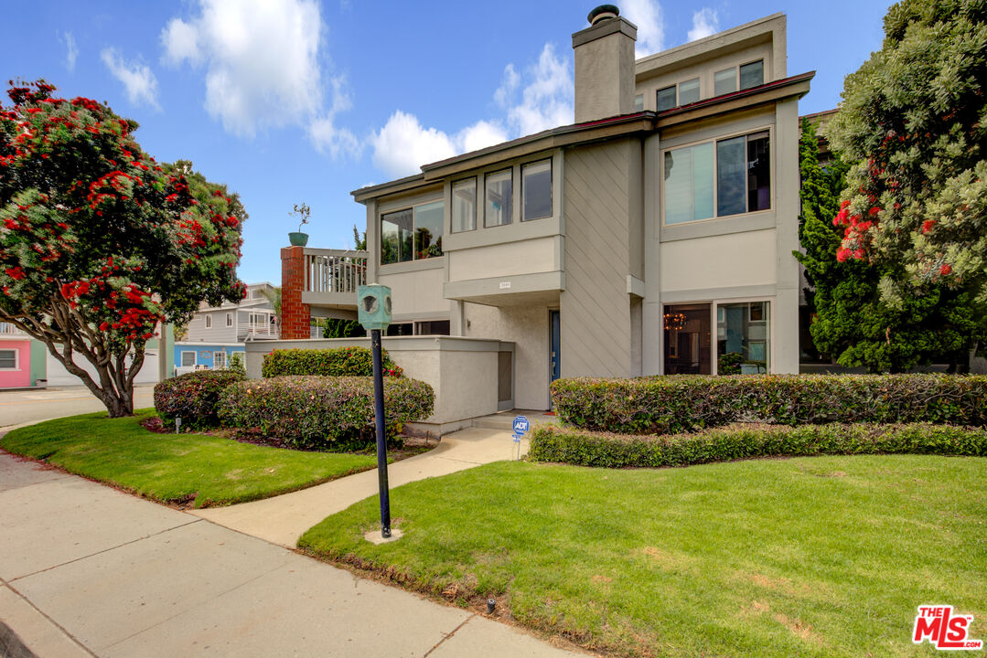 3544 Sunset Lane Oxnard, CA 93035 - Photo 2 of 56 a front view of a house with a garden
