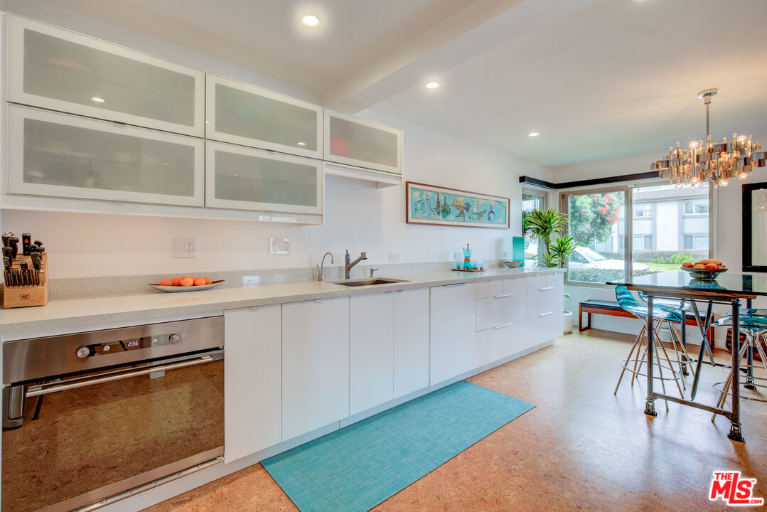 3544 Sunset Lane Oxnard, CA 93035 - Photo 22 of 56 a kitchen with a sink cabinets and window