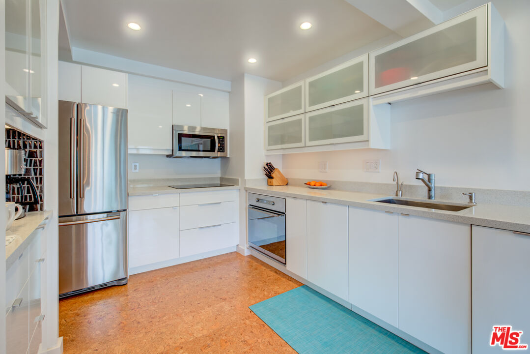 3544 Sunset Lane Oxnard, CA 93035 - Photo 24 of 56 a kitchen with stainless steel appliances a refrigerator and a sink