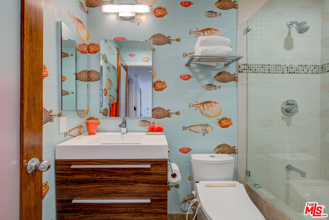 3544 Sunset Lane Oxnard, CA 93035 - Photo 25 of 56 a bathroom with a sink and a shower curtain