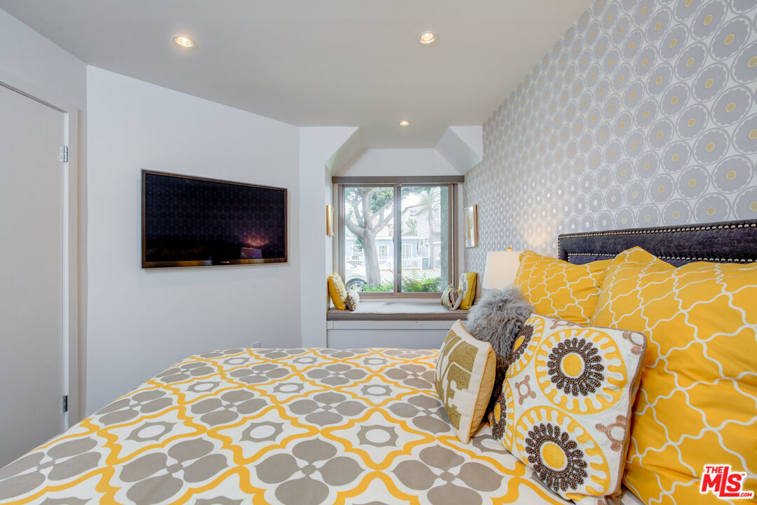 3544 Sunset Lane Oxnard, CA 93035 - Photo 28 of 56 a bedroom with a bed and flat screen tv