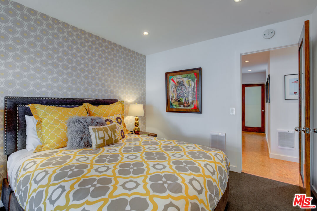 3544 Sunset Lane Oxnard, CA 93035 - Photo 30 of 56 a bedroom with a bed and a painting on the wall