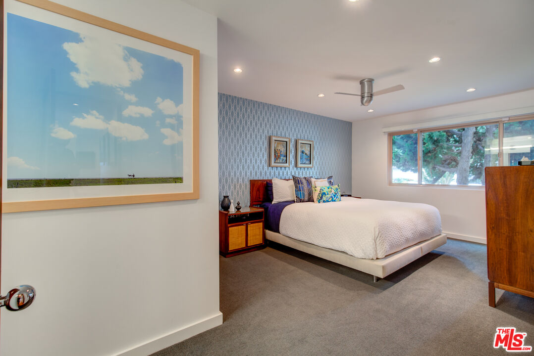 3544 Sunset Lane Oxnard, CA 93035 - Photo 33 of 56 a bed room with a bed and a large window