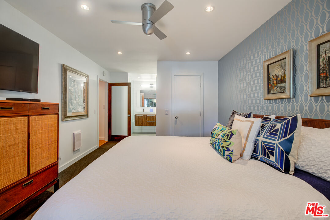 3544 Sunset Lane Oxnard, CA 93035 - Photo 35 of 56 a bedroom with furniture and a flat screen tv