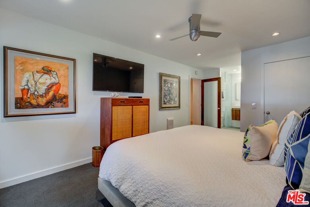 3544 Sunset Lane Oxnard, CA 93035 - Photo 37 of 56 a bedroom with a bed and a flat screen tv