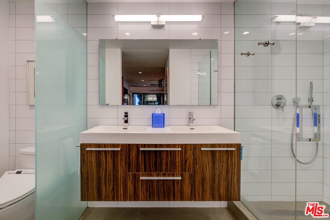 3544 Sunset Lane Oxnard, CA 93035 - Photo 40 of 56 a bathroom with a sink a toilet and shower