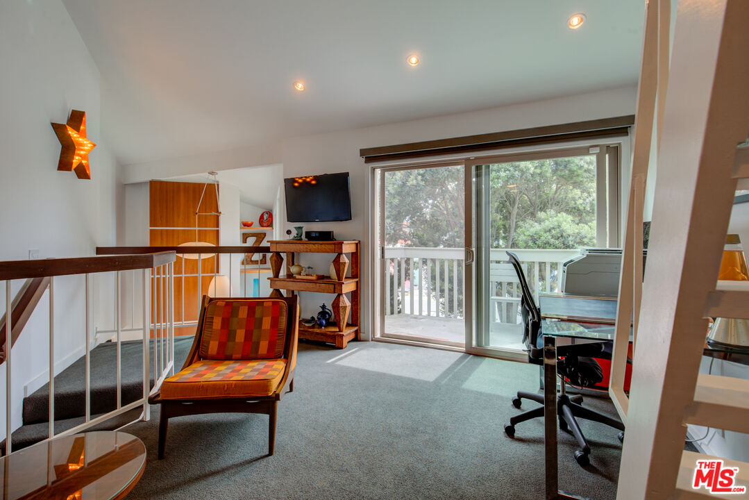 3544 Sunset Lane Oxnard, CA 93035 - Photo 45 of 56 a living room with furniture a rug and a large window