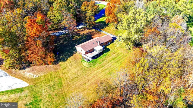 a aerial view of residential houses with yard